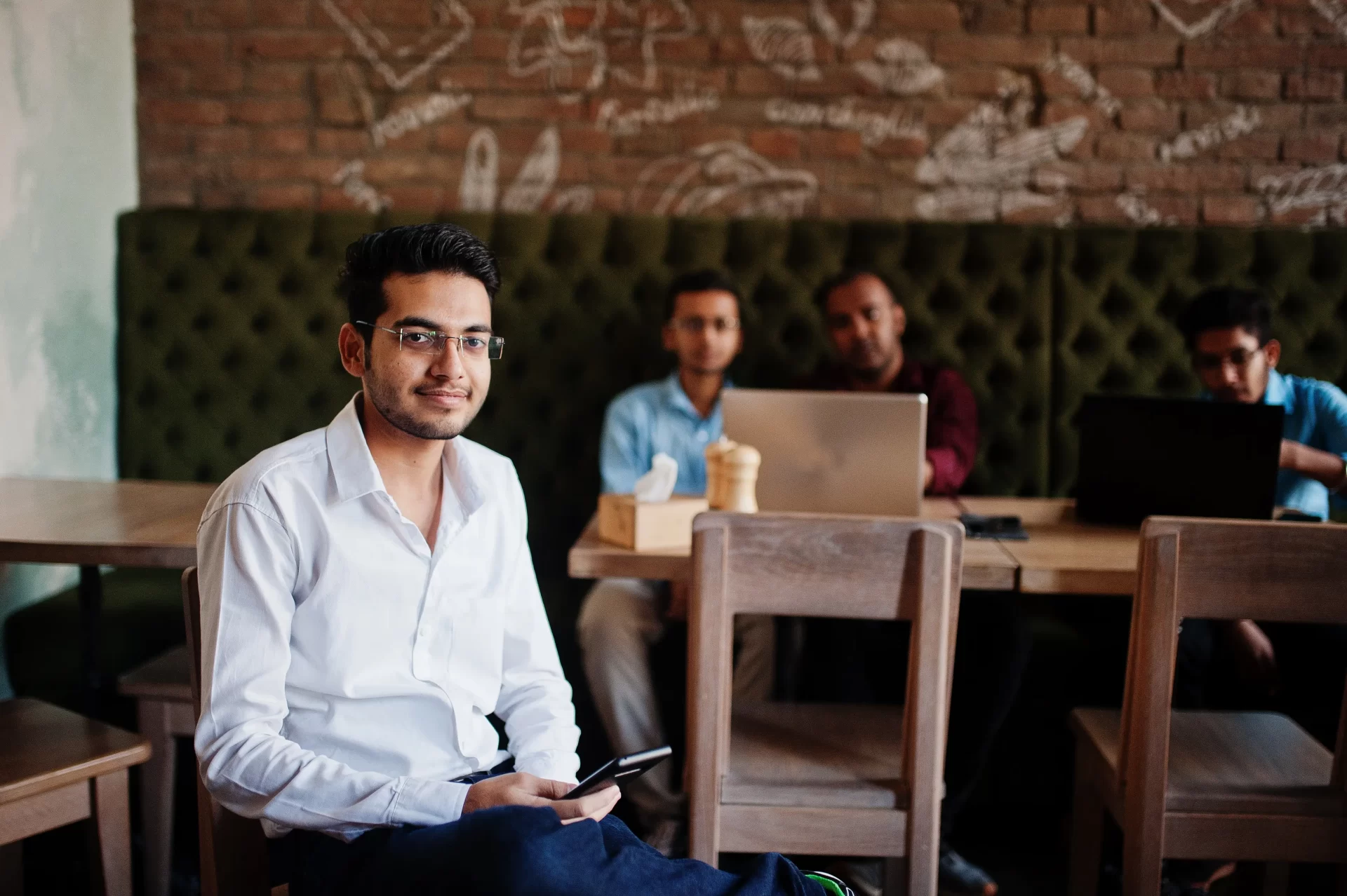 How HRIS Systems Streamline Recruitment for Growth | PayPeople Lahore HR managers using hris systems to screen job candidates for recruitment in Pakistan offices.