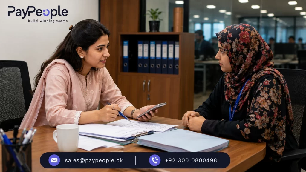 HR professional helping employee with leave and payroll information